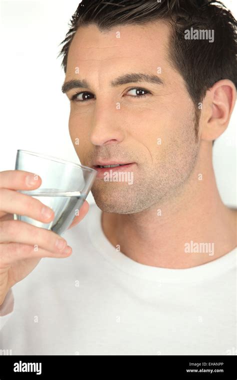 Man Drinking A Glass Of Water Stock Photo Alamy
