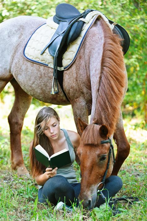 The program has a special focus on at Young Woman Reading Book With Horse Stock Image - Image of ...