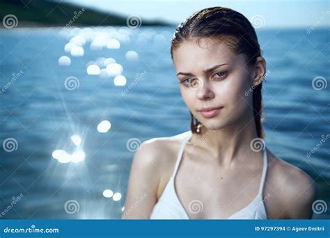 Young Beautiful Woman Is Swimming In The Sea In A Swimsuit Vacation