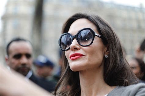 Angelina Jolie Goes To Guerlain Perfumes Shop On The