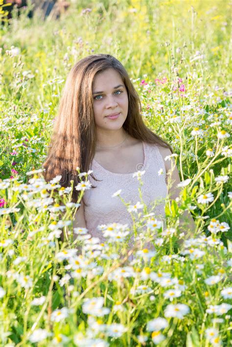 Girl Sits On Meadow With Wild Flowers Stock Photo Image Of Beautiful
