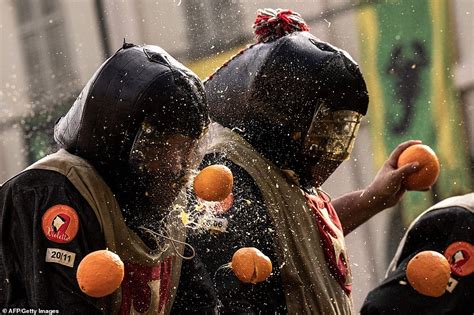 Italian Battle Of The Oranges Sees Teams Of Festival Goers Pelt Each Other With Fruit Daily