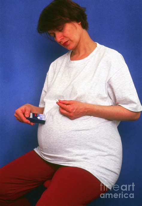 Pregnant Woman Holds Pill And Box Of Paracetamol Photograph By Faye