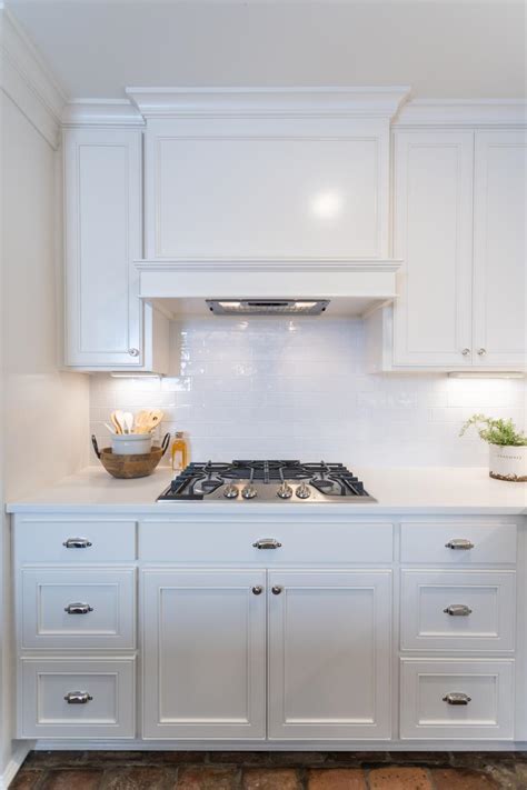 Subway tiles are rectangular shaped tiles that fit together to create beautiful walls and or backsplashes. Modern White Kitchen with White Subway Tile Backsplash | HGTV