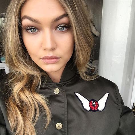 last month gigi hadid s hair color shifted from bright blonde to a darker honey shade with no