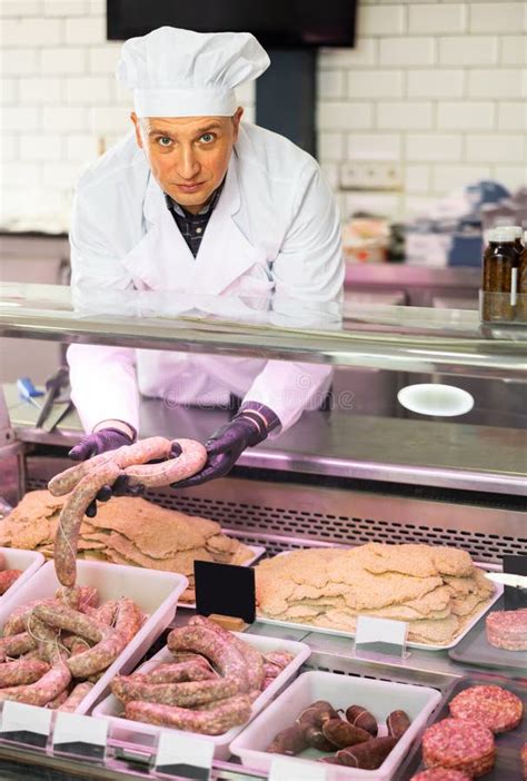 Adult Man Puts Meat Sausages In Showcase Stock Photo Image Of Meat