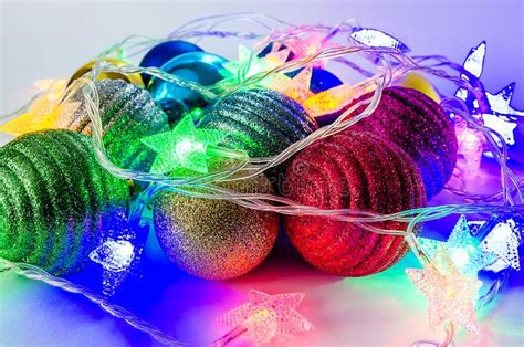 Decoration For The New Year Holiday Amid Colored Lights Stock Image
