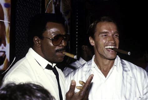 Arnold Schwarzenegger And Carl Weathers Smoking Cigars Photo Print 10