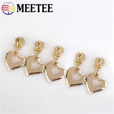 Just replace the zipper slider and the stop that keeps it from sliding off. Meetee 5# Heart Gold Metal Zipper Slider for Metal Zipper Puller DIY Zipper Repair Kit Bags ...