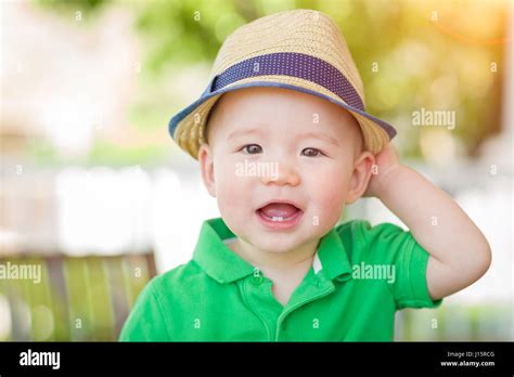 Portrait Of A Happy Mixed Race Chinese And Caucasian Baby Boy Wearing
