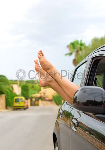 Girl With Her Feet Out Of The Window Of The Stock Photo Crushpixel