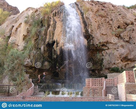 Tourists At The Hot Spring Waterfall And Natural Pool At Hammamat Ma In