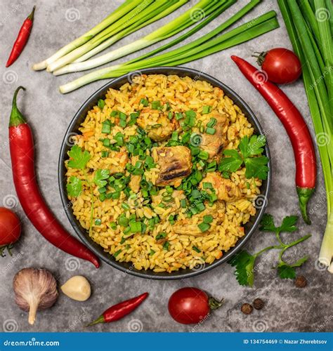 Rice Pilaf With Meat Garlic Carrot And Onion On Grey Background Top