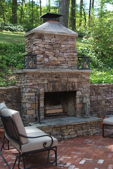 Outdoor Stone Fireplace Warming Up Exterior Space - Traba ...