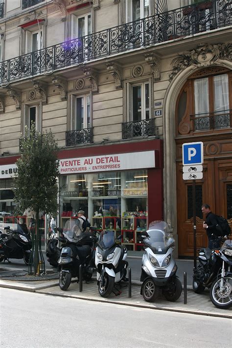Motorcycles Parked On A Street In Paris France By Kalin Nacheff