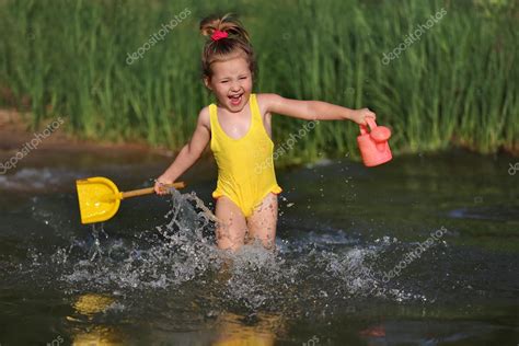Little Girl Swimming In Lake Outdoors Closeup Portrait Of