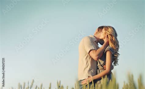 Stunning Sensual Young Couple In Love Embracing At The Sunset In Stock