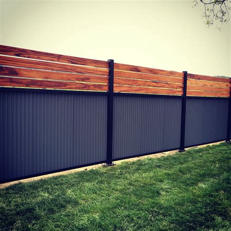 Custom Privacy Fence Built Out Of Metal Post Tiger Wood And