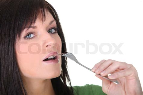 Woman Putting Fork To Mouth Stock Image Colourbox