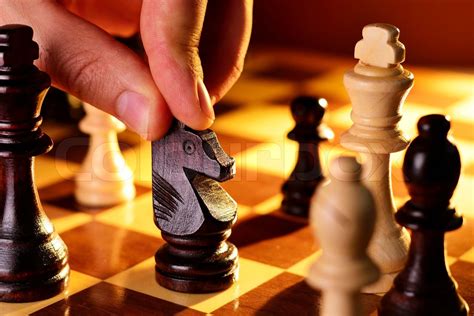 Mans Hand Playing A Game Of Chess Stock Image Colourbox