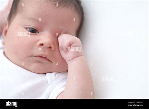 Baby Girl Rubbing Her Eyes Stock Photo Alamy