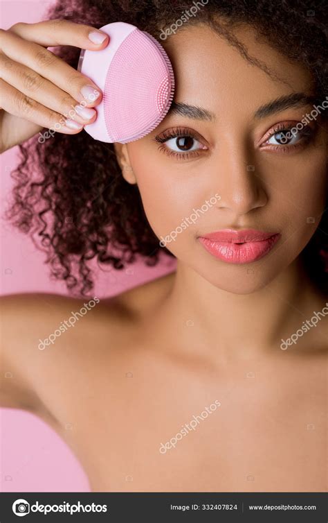 Naked African American Woman Using Pink Deep Cleaning Face Tool