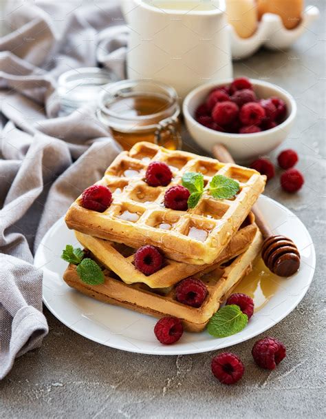 Homemade Waffles With Berries In Plate On A Concrete Background