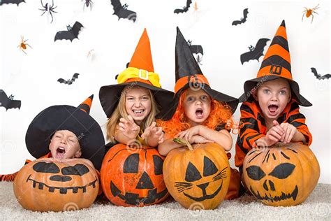 Cheerful Children In Halloween Costumes Celebrating Halloween Stock