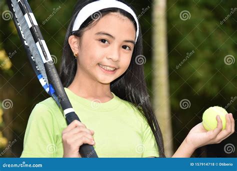 Smiling Pretty Minority Female Tennis Player With Tennis Racket Stock
