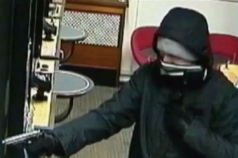 Gun Toting Bank Robber S Style Is So Laid Back Bystanders Don T Realise He S Walking Away With