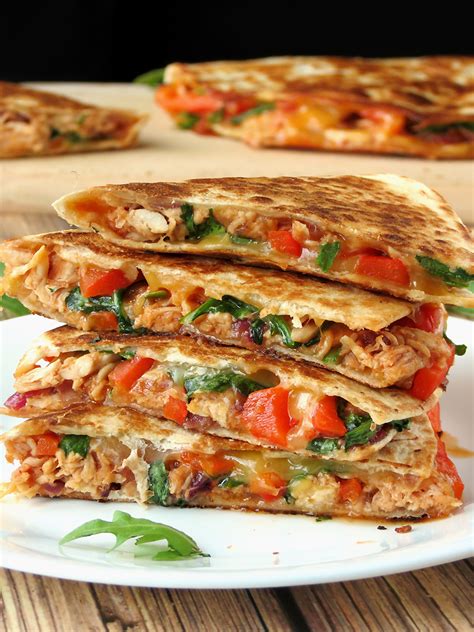 People are surprised by the combination of chicken, apples, tomatoes and corn inside the crispy tortillas, but they love it. Easy Chicken Quesadillas - Yummy Addiction