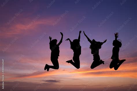 Silhouette Of Young People Jumping Togetherfriend Having Funhappy