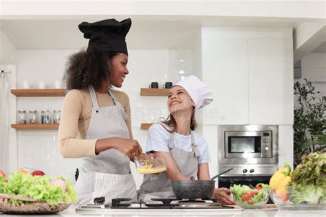 Happy Homosexual Lesbian Lgbt Couple Wear Apron And Chef Hat Cooking Romantic Love Meal Food At