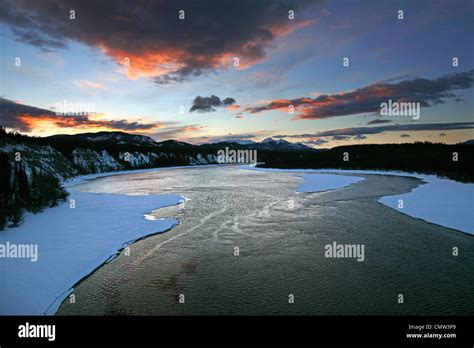 Sunrise Over The Teslin River Yukon Stock Photo Alamy