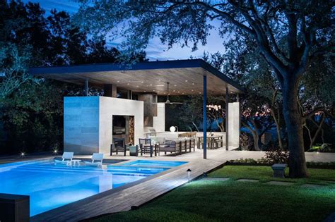 This Poolside Living Room And Kitchen Sits Under A Large Floating
