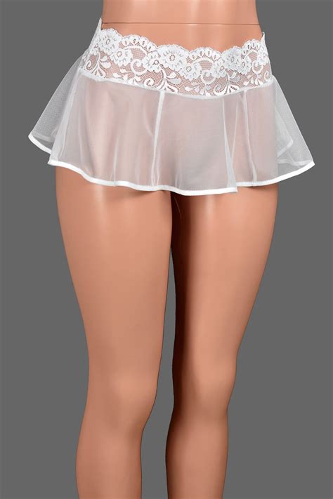A Women S White Skirt With Sheer Garters On The Bottom And Side