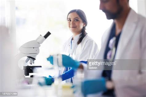 Two Scientist Microscope Photos And Premium High Res Pictures Getty