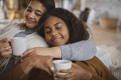 Affectionate Mother And Daughter Cuddling With Tea Stock Image F0335957 Science Photo Library