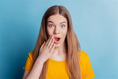Premium Photo Portrait Of Excited Shocked Girl Open Mouth Raise Palm On Blue Background