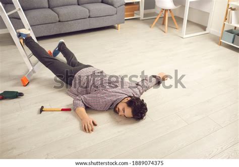 Young Man Fallen From Ladder Lying Unconscious On Floor Unlucky