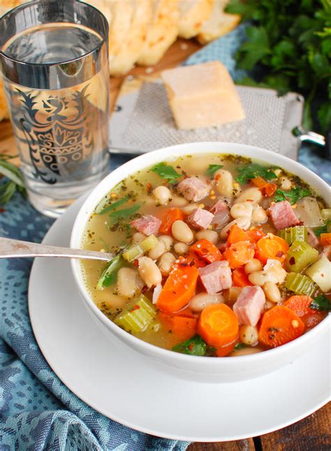 Made with a ham bone, dried white beans, chopped carrots, celery, onions, and garlic, chicken stock, and fresh thyme, this recipe takes minutes to assemble in a slow cooker. White Bean and Ham Soup Image 8 - A Cedar Spoon