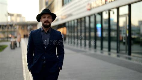 Attractive And Elegant Dressed Man Is Walking Alone On City Street In