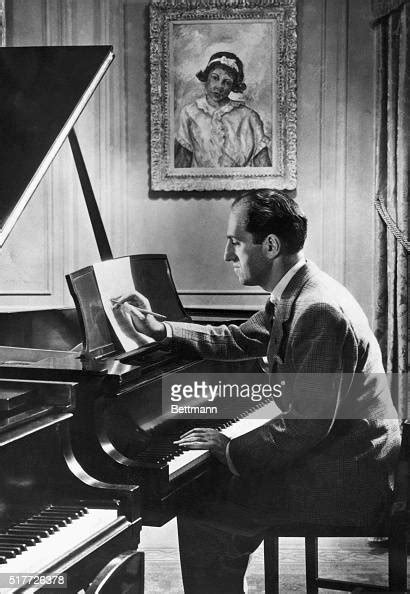 George Gershwin At The Piano With One Of His Paintings Hanging In The