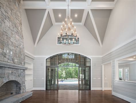 Flaunting a trendsetting silhouette, the soletren living room set puts the contemporary in your contemporary home. LOVE LOVE LOVE this gray and white living room!! Floor to ceiling stone fireplace, glass ...