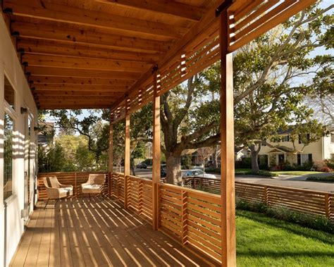 A horizontal cedar railing is framed by modern matte black rails, lending a modern appeal that creates privacy on this deck. Horizontal Deck Railing Embraces Every Outdoor Living with ...