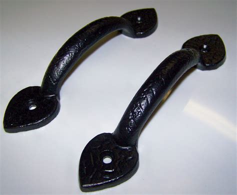 Back to back pair of traditional style decorative door pulls. Carriage House Garage Door Decorative Hardware