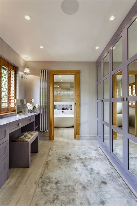 Generally, this type of design is combined with a dressing makeup table and a study table. Stunning master wetroom with walk-through dressing room ...