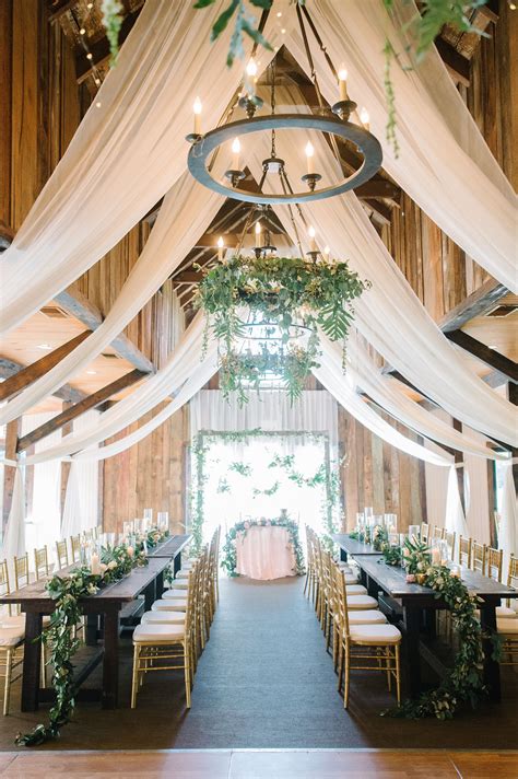 Wedding Reception Venue With Curtains Greenery And Soft Bulb Lighting Beautif Barn