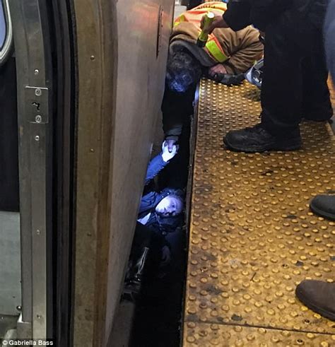 horrifying photos of woman trapped under nyc subway train daily mail online