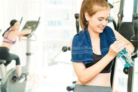 Sport Woman Drinking Fresh Water While Exercising In Fitness Stock